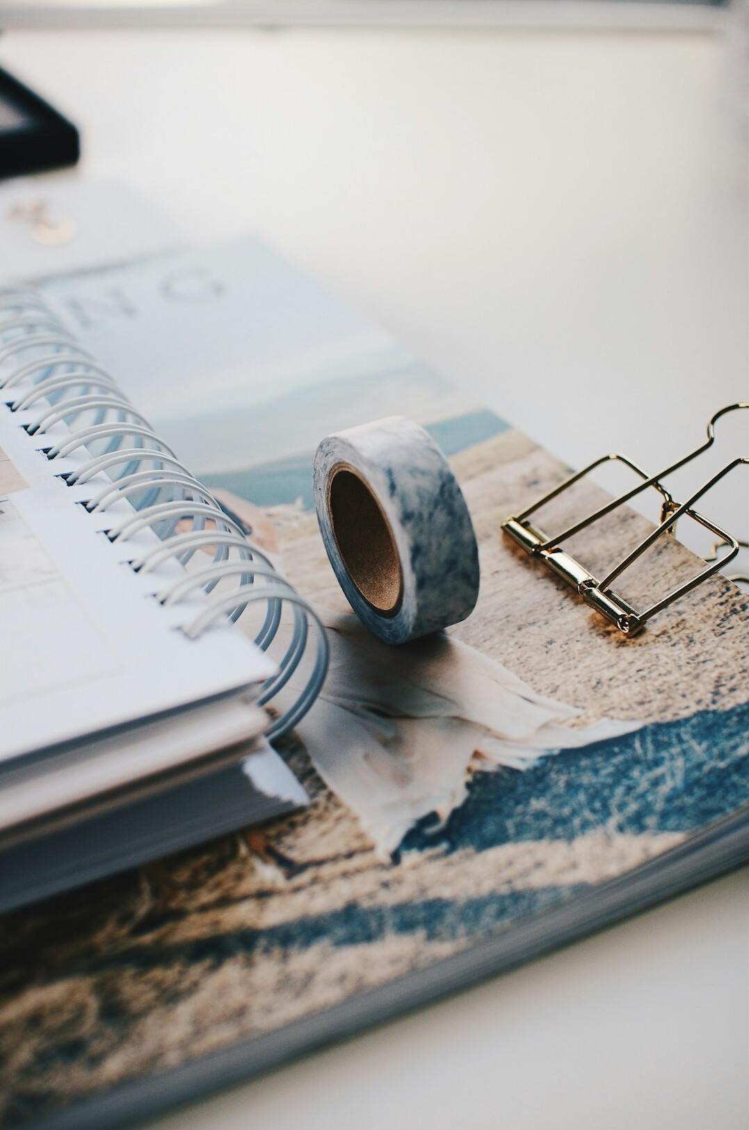 Handwritten research notes and papers on a wooden desk