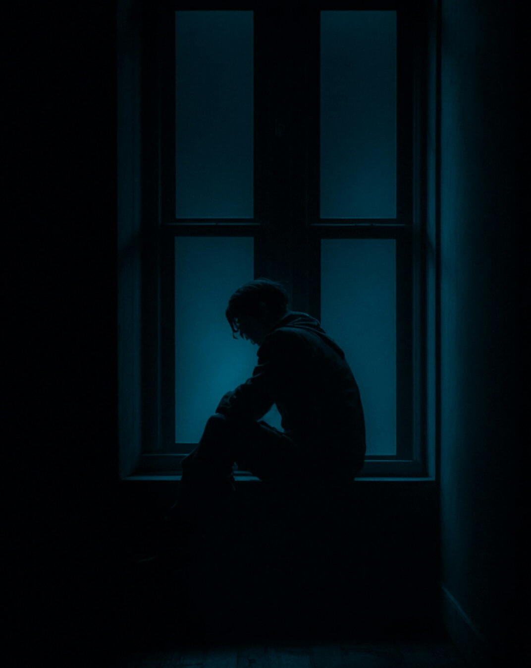 person thinking alone in room
