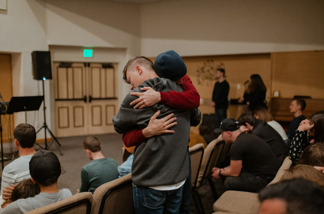 people hugging in difficult times