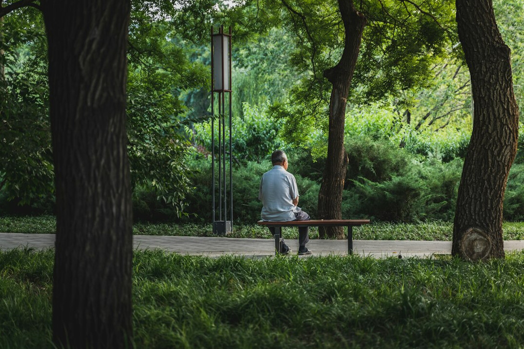 person thinking alone in park