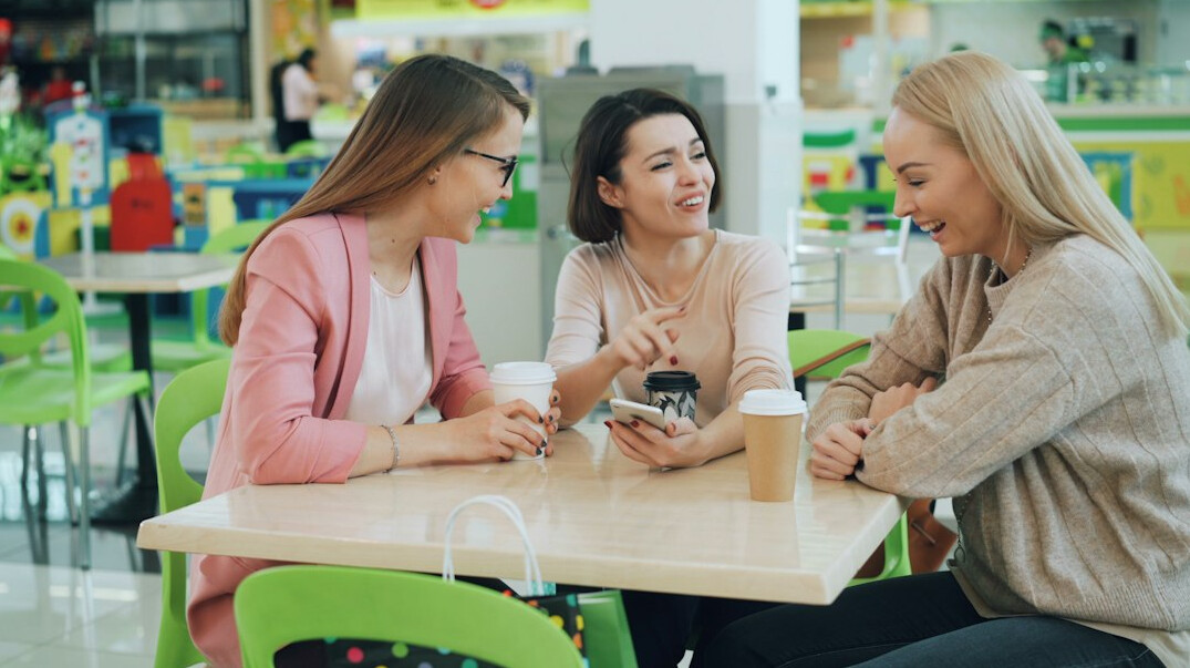 friends discussing in cafe